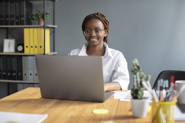 portrait-young-woman-working-her-laptop-startup-company